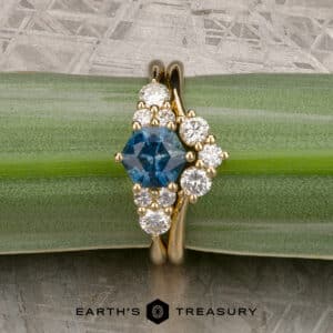The "Estelle" ring in 18k yellow gold with 1.25-Carat Montana Sapphire alongside the "Estelle" band in 18k yellow gold