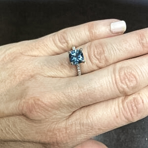A photo from a customer review featuring a Montana sapphire set in a ring not made by Earth's Treasury