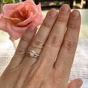 A photo from a customer review featuring a custom ring in 14k rose gold with 1.32-carat Montana sapphire