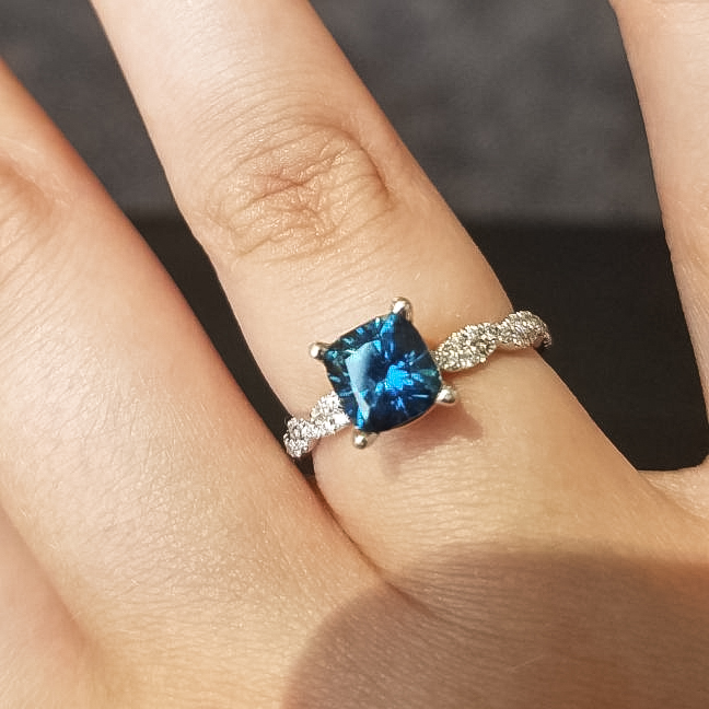 A photo from a customer review featuring a Montana sapphire set in a ring not made by Earth's Treasury