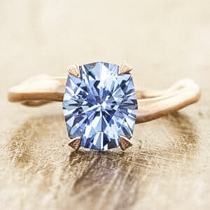 A photo from a customer review featuring a Montana sapphire set in a ring not made by Earth's Treasury