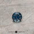 A color-change Montana sapphire in a classic diamond round brilliant design