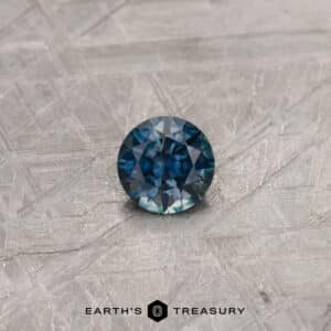 A color-change Montana sapphire in a classic diamond round brilliant design