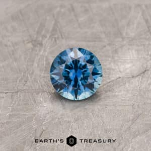 A blue Montana sapphire in a classic diamond round brilliant design