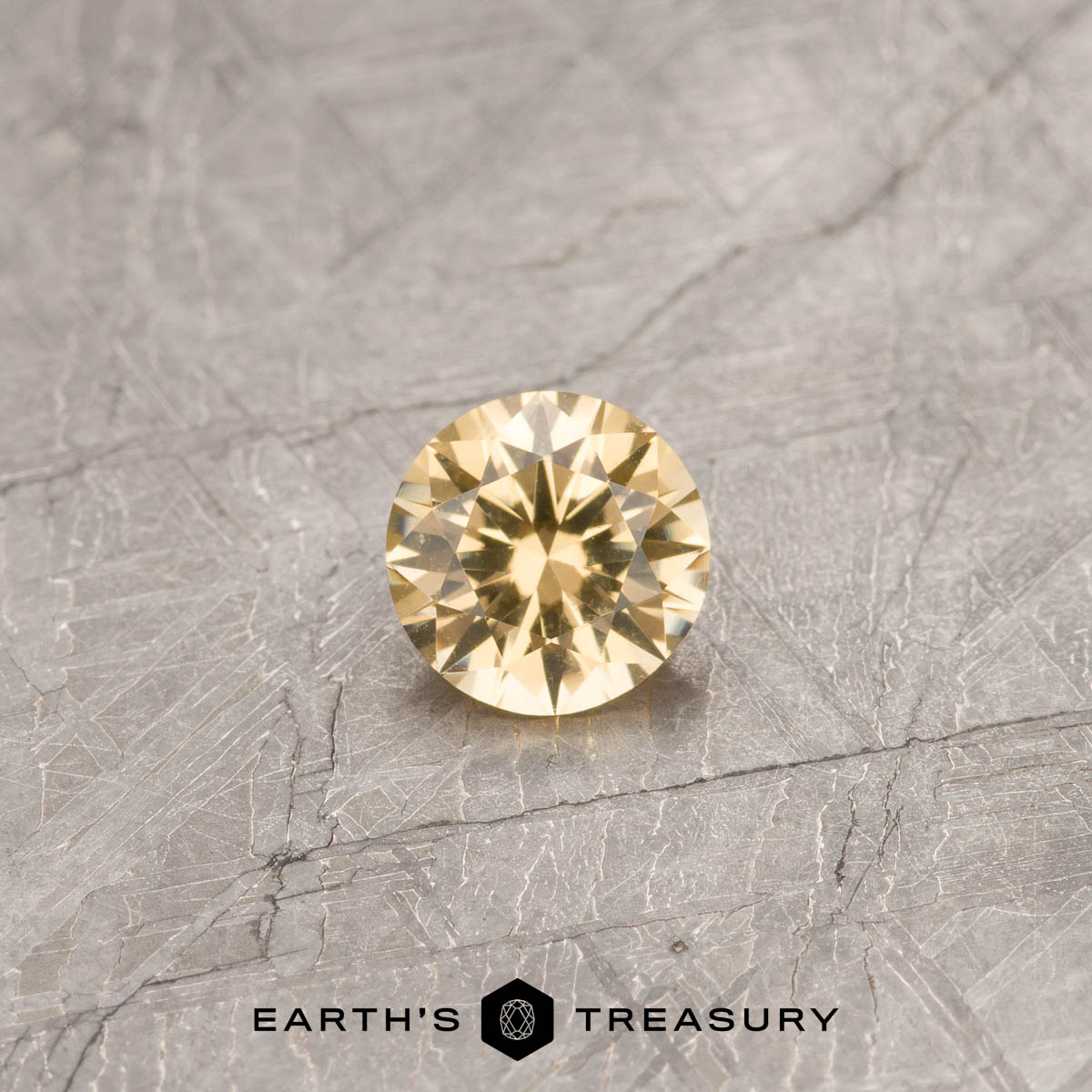 A Yellow Grossular Garnet in a classic diamond round brilliant design