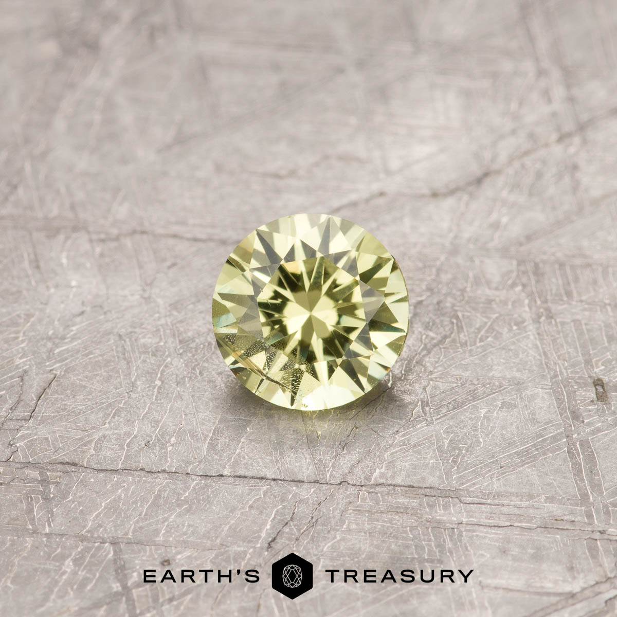 A Yellow-Green Mali Garnet in a classic diamond round brilliant design