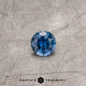 A blue Montana sapphire in a classic diamond round brilliant design