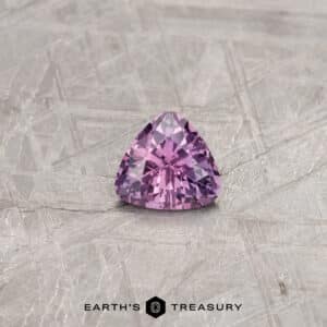 A color-change Montana sapphire in a custom trillion design