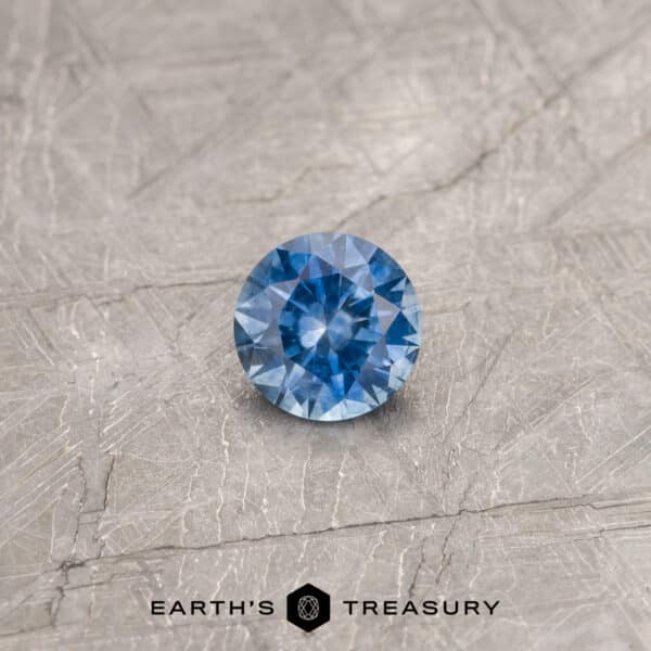 A blue Montana sapphire in a classic diamond round brilliant design