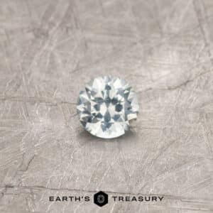 A white Montana sapphire in a classic diamond round brilliant design