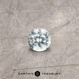 A white Montana sapphire in a classic diamond round brilliant design