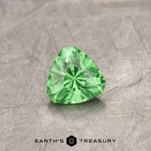 A Green Tsavorite Garnet in our "Triptych" trillion design
