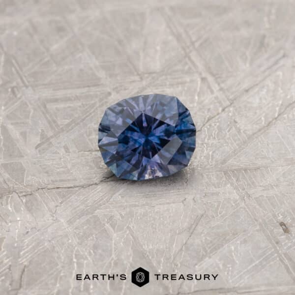A color-change Montana sapphire in our "Hyperbola" oval design