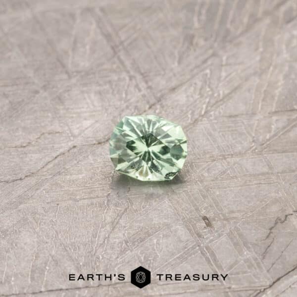 A green Kornerupine in our "Helena" oval design