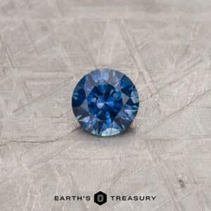 A color-change Montana sapphire in a classic diamond round brilliant design