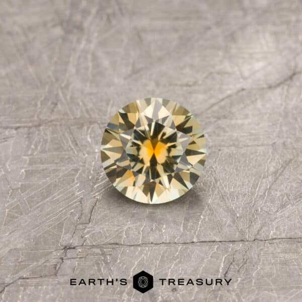 A yellow Montana sapphire in a classic diamond round brilliant design