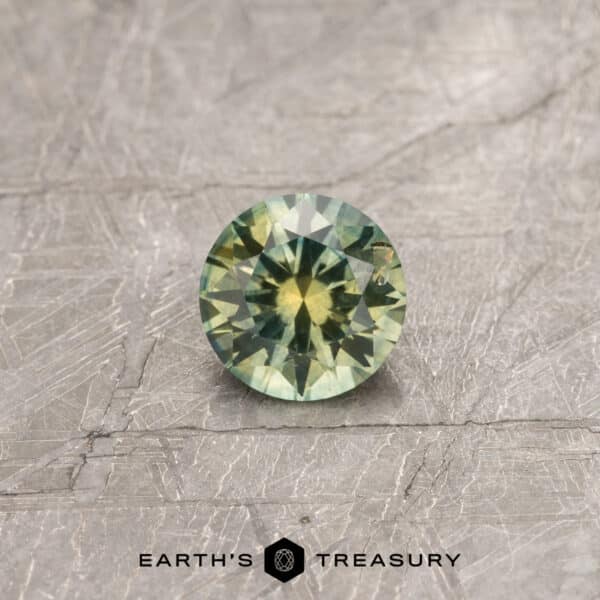 A yellow-green Montana sapphire in a classic diamond round brilliant design
