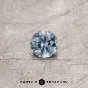 A gray Montana sapphire in a classic diamond round brilliant design