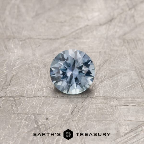 A gray Montana sapphire in a classic diamond round brilliant design