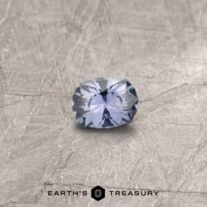 A blue Montana sapphire in a custom oval desing