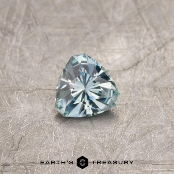A blue-green Montana sapphire in our "Triptych" trillion design