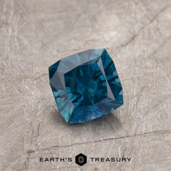 A blue-green Montana sapphire in our "Aurora" square cushion design