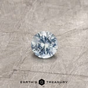 A blue Montana sapphire in a classic diamond round brilliant design