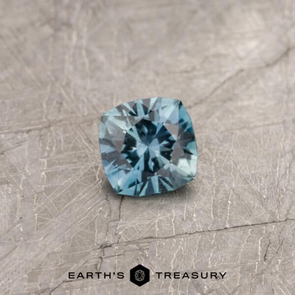 A blue-green Montana sapphire in our "Stella" square cushion design