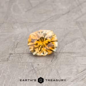 An orange Montana sapphire in our "Helena" oval design