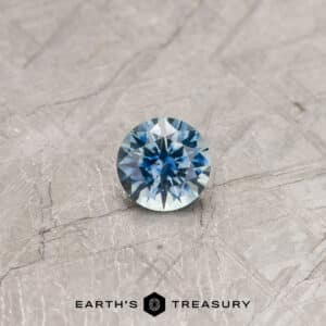 A blue Montana sapphire in a classic diamond round brilliant design
