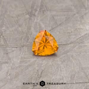 An orange Montana sapphire in our "Triptych" trillion design
