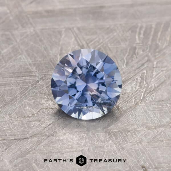 A purple Montana sapphire in a classic diamond round brilliant design