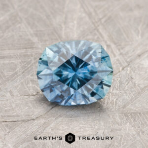 A blue-green Montana sapphire in our "Hyperbola" oval design