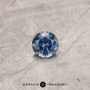 A purple Montana sapphire in a classic diamond round brilliant design