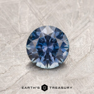 A purple Montana sapphire in a classic diamond round brilliant design