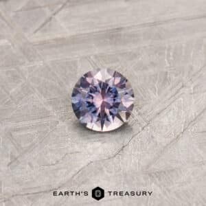 A purple Montana sapphire in a classic diamond round brilliant design