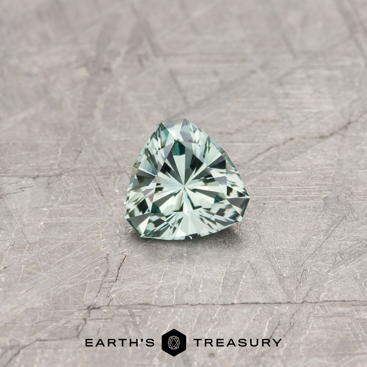 A green Montana sapphire in our "Triptych" trillion design