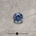 A color-change Montana sapphire in a classic diamond round brilliant design