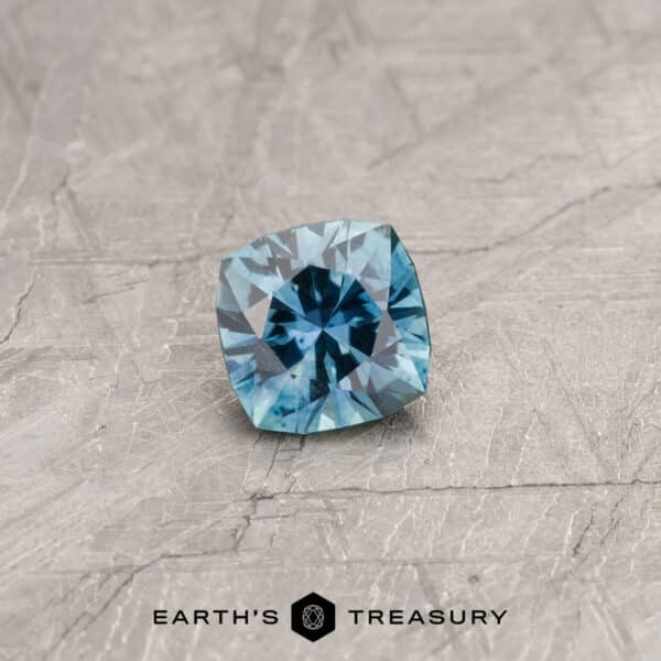 A blue-green Montana sapphire in our "Stella" square cushion design