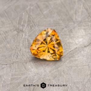An orange Montana sapphire in our "Triptych" trillion design