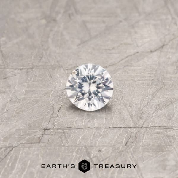 A white Umba sapphire in a classic diamond round brilliant design