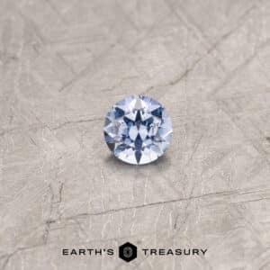 A blue Umba sapphire in a classic diamond round brilliant design