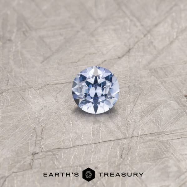 A blue Umba sapphire in a classic diamond round brilliant design