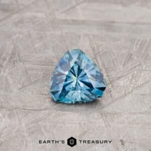 A blue-green Montana sapphire in our "Triptych" trillion design