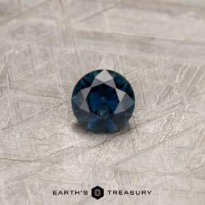 A blue Australian Sapphire in a classic diamond round brilliant design