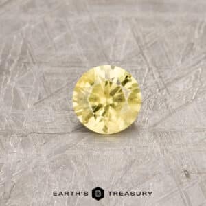 A yellow Australian Sapphire in a classic diamond round brilliant design