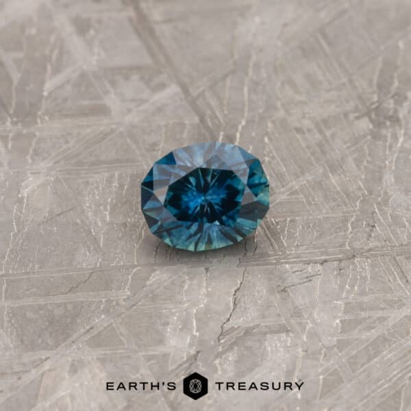 A blue-green Montana sapphire in our "Serendipity" oval design