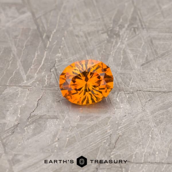 An orange Montana sapphire in our "Serendipity" oval design