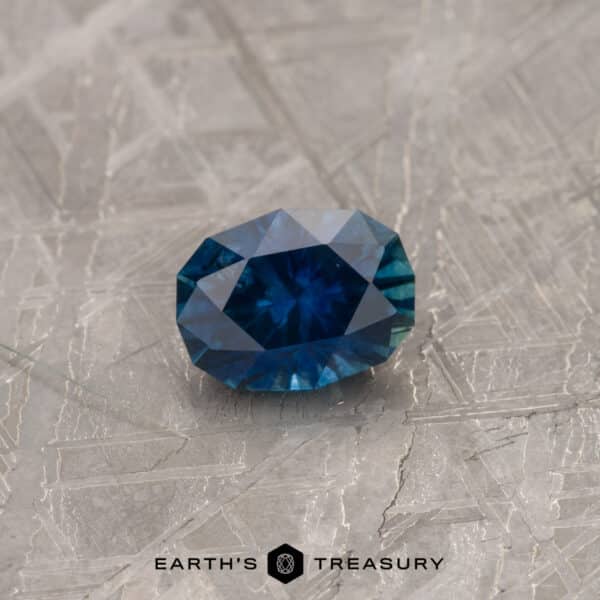 A blue-green Montana sapphire in our "Testudo" oval design