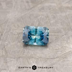 A blue-green Montana sapphire in our "Fourth of July" rectangle design